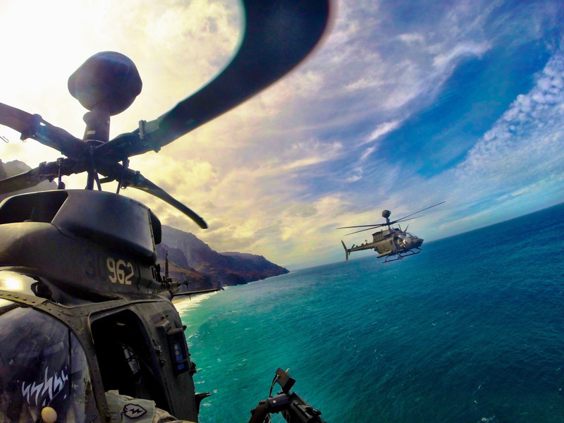 Illustration for article titled Check Out This Award Winning Pic Of OH-58Ds Skirting The Hawaiian Coast